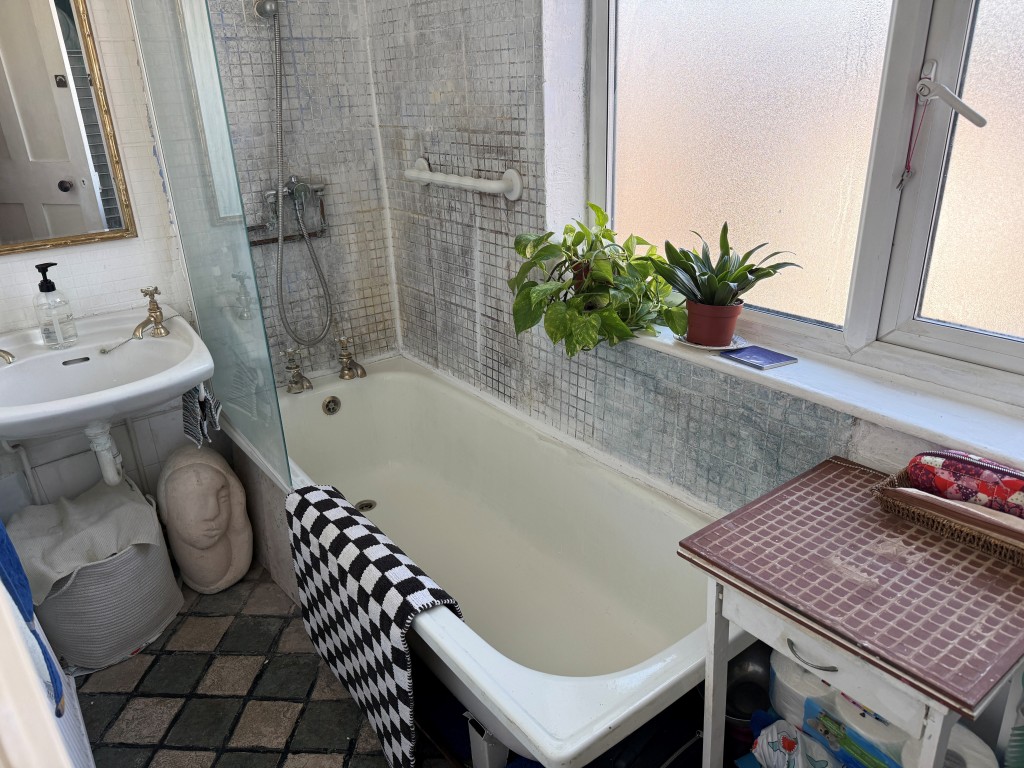 Lot: 128 - TWO-BEDROOM FLAT WITH GARAGE IN NEED OF UPDATING - White bathroom with sink and shower unit